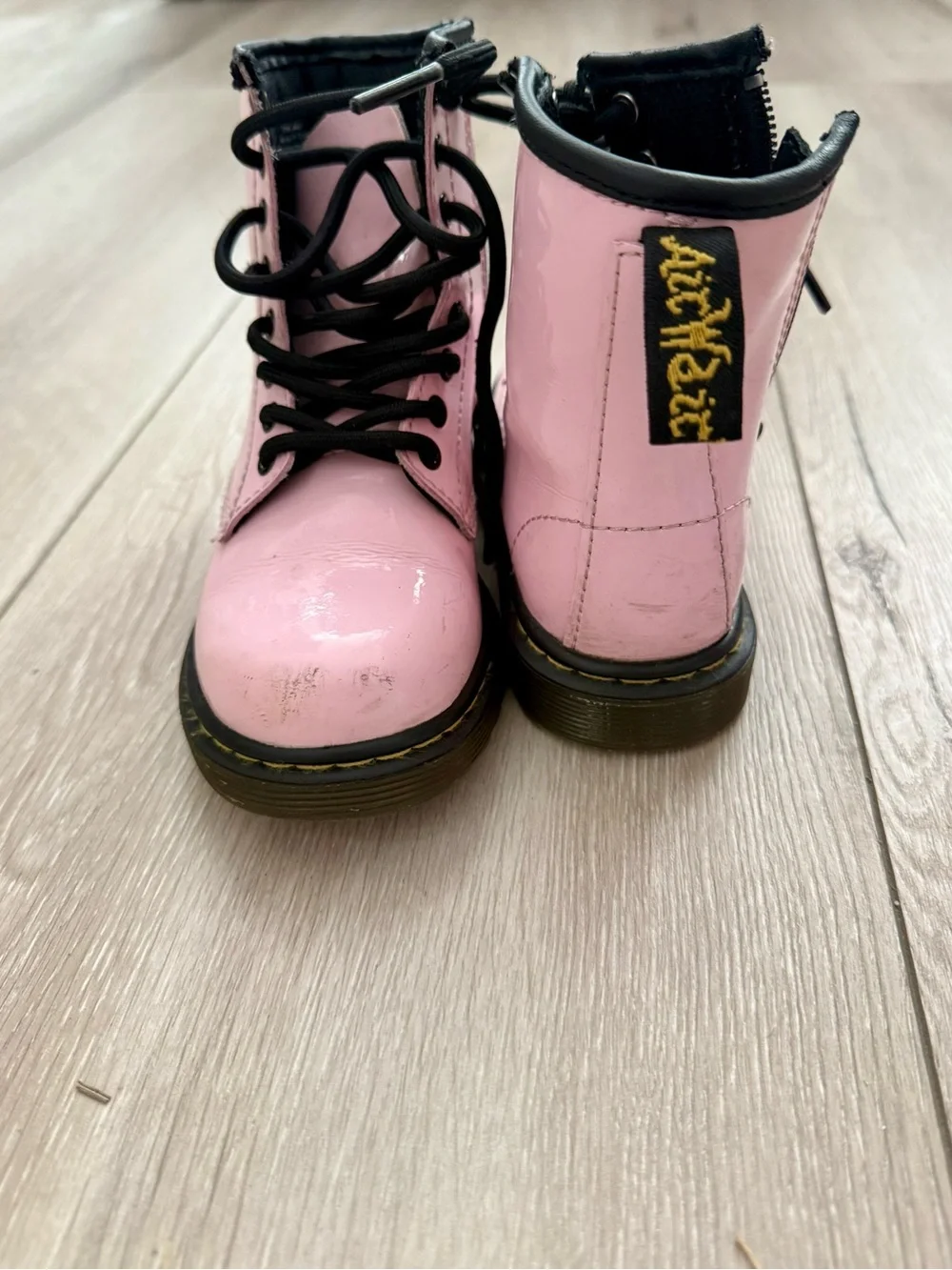 Dr. Martens Pink Lace-Up Kids Combat Boots with Black Laces